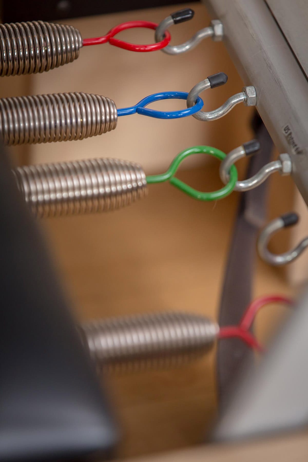 Pilates Reformer springs used during a group Pilates class at Reformed Atlanta Studio